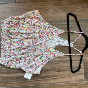 Floral surplice neck top